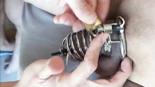 Prostate milking with a woman wearing a chastity belt and using a vibrator
