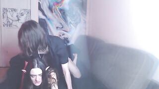 A couple enjoys a intimate moment on their couch