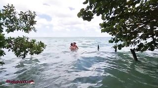 A couple enjoys romantic sex right in the middle of the sea