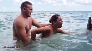 A couple enjoys romantic sex right in the middle of the sea