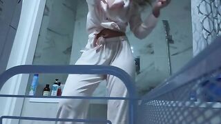 The girl masturbates her pussy in the bathroom, craving no one to see