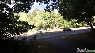 A woman teaches how to squirt on the city sidewalk