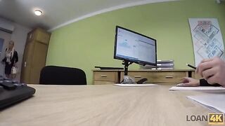 A business lady gets a loan from the bank to develop her business