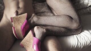 A sexy girl in high heels and pantyhose will excite you with her feet