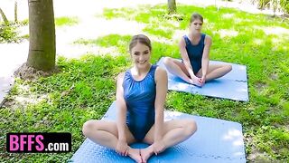 Gymnast Katie Kush and Kenzie Madison are stretching on a cock after training