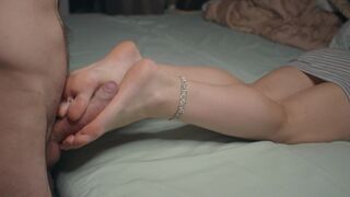 A petite girl shows off her small feet and skills in footjobs