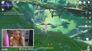A gamer girl recreates a scene from Genshin Impact with a huge dildo