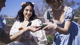 A group of friendly girls, including petite Riley, have fun in the park