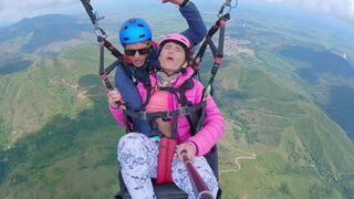 A girl squirts while paragliding 2200 m above the sea, in a daring act