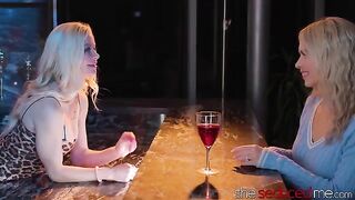 The bartender, a seductive lesbian with striking blonde hair, gave the drink to the young girl