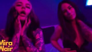 Two submissives are having fun with a man, using a huge toy together