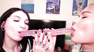 Lesbian beauties fuck each other with a double-ended dildo in their wet pussies