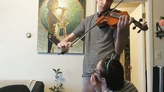 The couple was interrupted while the girl tried to play violin