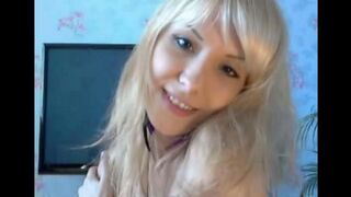 Blonde plays with her pussy using her fingers in a solo act