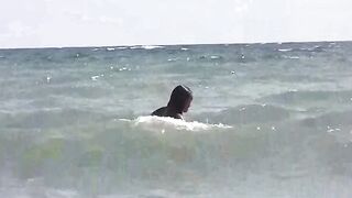 A group of girls are getting sunbathed naked on the beach