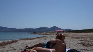 A blowjob in public on the beach, with a cumshot full of sperm