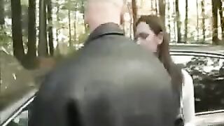A girl was put on the bonnet of a car and she began to be torn up