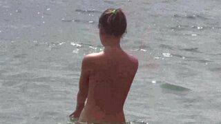 Nudists have a lot of fun on the barefoot beach