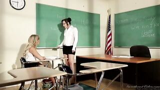 A girl is having fun with her lesbian teacher right on the table