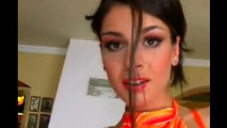 Beautiful brunette masturbates in a leather chair