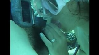 A man has sex with a woman with a hairy pussy under the water