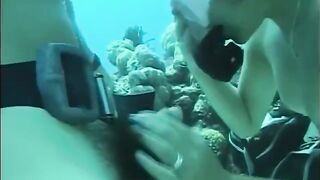 A man has sex with a woman with a hairy pussy under the water
