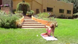 A blonde with big tits is having fun on the lawn in 4K