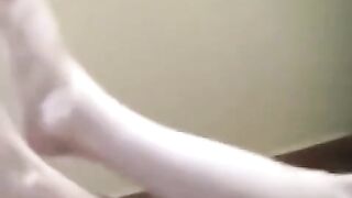 A naked girl with big natural tits is smoking in the room