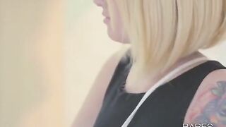 A tattooed girl plays with her pussy in a hot solo session
