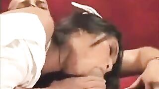 A hot nurse in Asian style is giving an erotic lesson on the couch