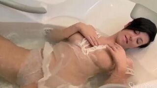 Brunette takes shower and rubs her lonely pussy with her fingers