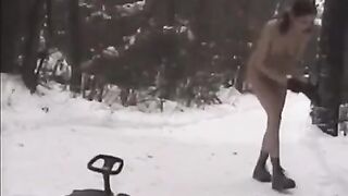 Naked beauties play snowballs in the street during the winter