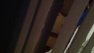A man shoots a hidden camera as his neighbors have sex
