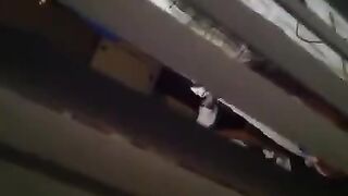 A man shoots a hidden camera as his neighbors have sex