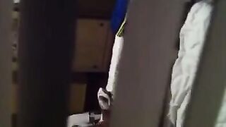 A man shoots a hidden camera as his neighbors have sex