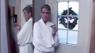 The wife has fun with her lover on the balcony while her husband is away