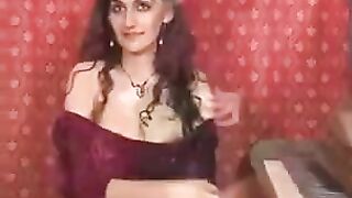 A girl plays with her hairy pussy using a finger, no panties