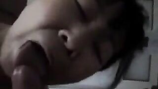 Chinese beauty practices her blowjob skills on an adult man