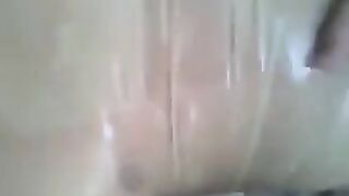 The guy put a condom on his dick and masturbated
