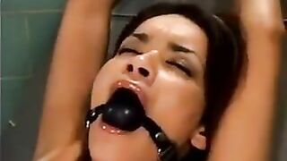 A bald guy fucked a girl with the help of a sex machine