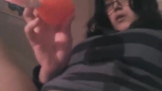 A girl played with her pussy using a powerful vibrator on the bed