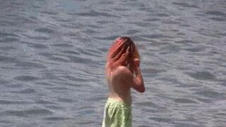 A group of nudists are having fun on the coast of Crimea