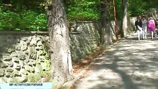A girl with big tits goes for a walk and shows them to passers-by