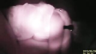 A couple engages in passionate sex, hidden behind the wall
