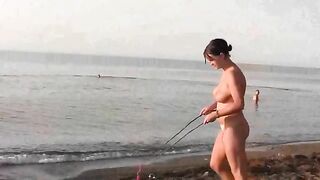 A couple has fun on the beach without any clothes