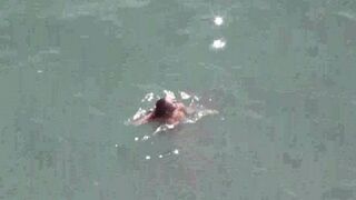 A pair of passionate lovers who love to get naked on the sea