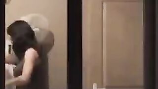 He admires himself naked in the mirror, completely bare