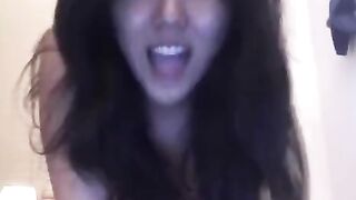 Asian beauty masturbates on her bed, showcasing solo passion in a steamy homemade session
