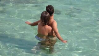 A hot girl gave a blowjob to the guy right in the sea