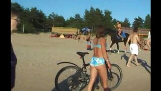 A girl has sex with her head on the beach